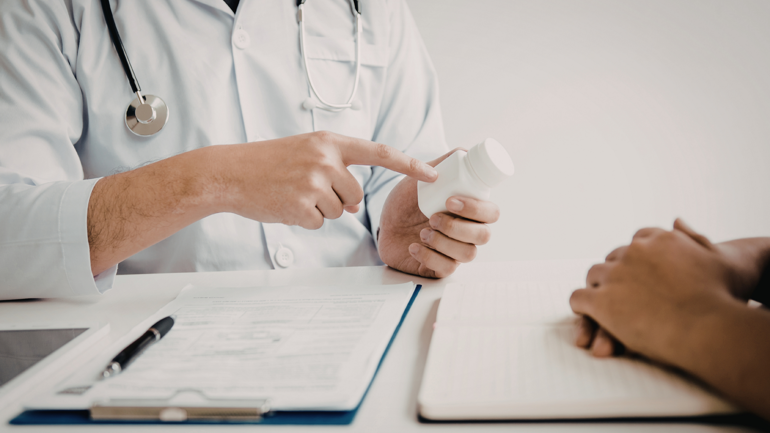Photo of GP talking to patient about prescriptions